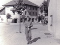Captain Herman Gluckman  The building behind him is still standing 70 years later, but those little trees are now very big and obscure it, for the most part. (CF)
